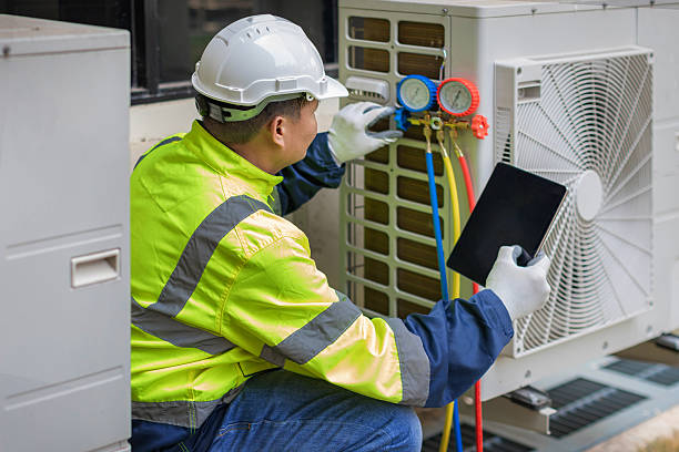Professional Heat Pump Repair technician working in Stow, MA